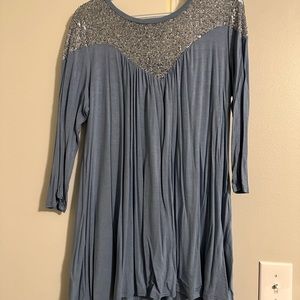 Flowy tunic with neckline sequin detail.